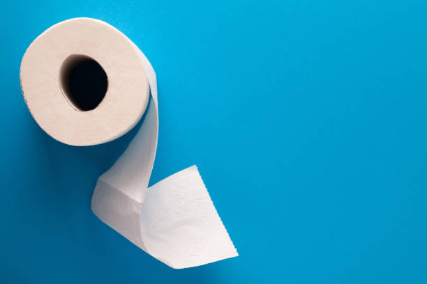 Toilet Paper On Blue Background Toilet paper on blue background with empty room for text. Flat lay. Top view toilet paper photos stock pictures, royalty-free photos & images