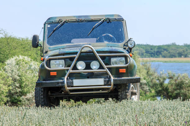 istock Old SUV stands in a clearing 1214736277