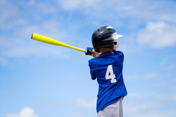 little league baseball boy batting - field baseball grass sky imagens e fotografias de stock
