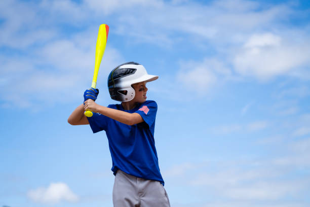 istock Little League Baseball Boy Batting 1214737701