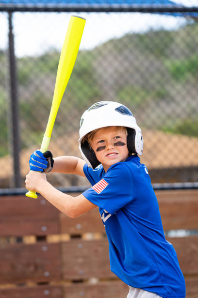 istock Little League Baseball Boy Batting 1214737988