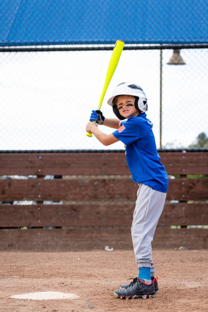 istock Little League Baseball Boy Batting 1214739759