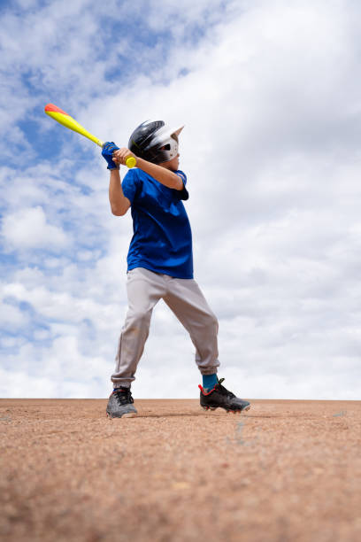 istock Little League Baseball Boy Batting 1214739872