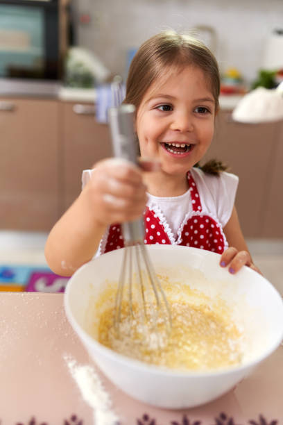 istock Adorable little chef girl 1214743910