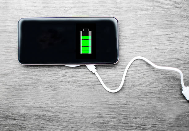 istock Charge Smart Phone connected to wireless charger 1214743940