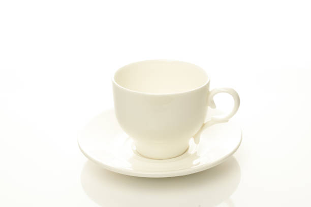 istock mug and saucer on a white background 1214747721
