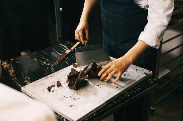 Chef making chocolate cake. process of making cake stock photo