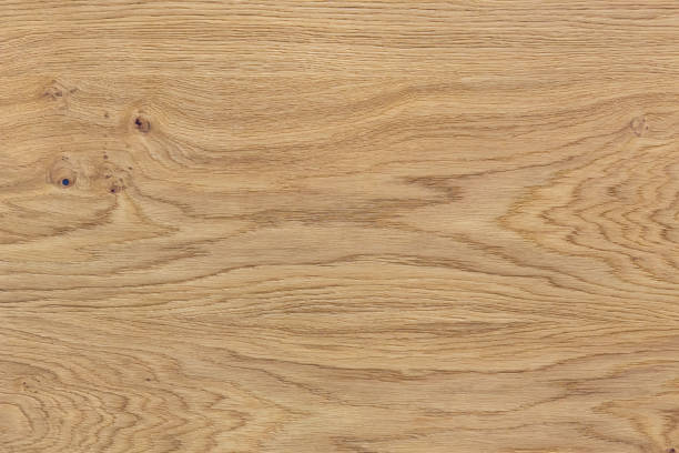 Natural wood background Light natural wood texture. The board have a strong clear texture of wood with knots. A wood grain pattern featuring even grains of wood running vertically across the image. oak wood material photos stock pictures, royalty-free photos & images