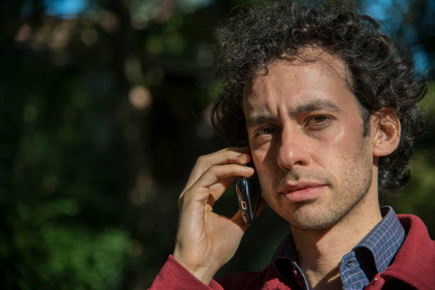 istock a man at phone in open air 1214748306