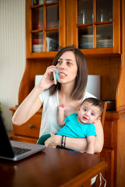 istock woman working from home with children 1214750471