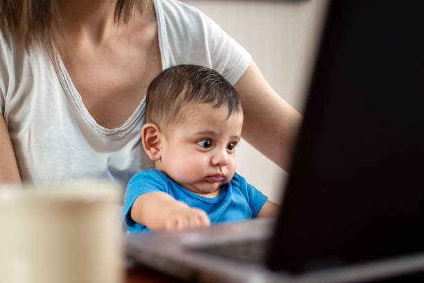 istock woman working from home with children 1214750532
