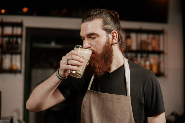 istock Pleasant bearded hipster barista drinking coffee 1214751834