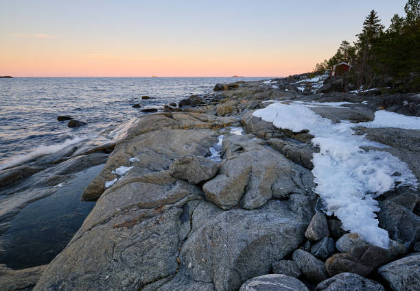 istock Ice on a cliff by the sea with cracks and shadow 1214751873