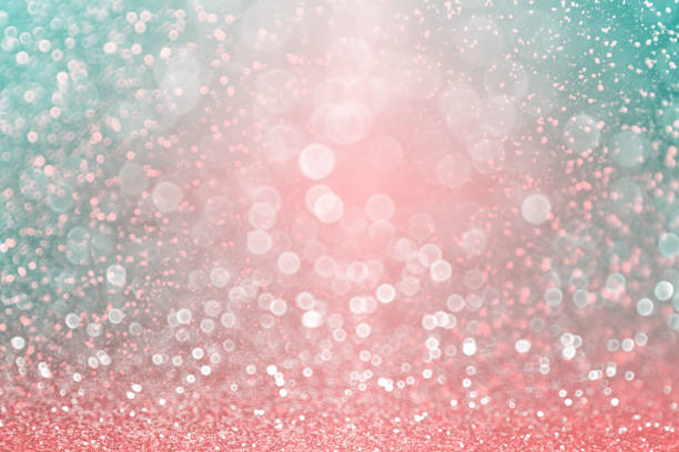 Fancy teal green glitter, coral pink and peach sparkle turquoise background stock photo