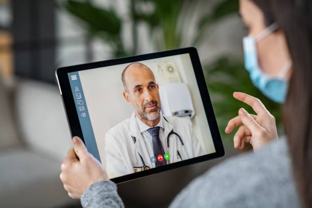 istock Sick patient in video conference with doctor 1214753406