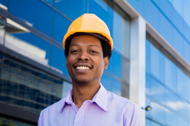 istock Professional architect with yellow helmet outdoors. 1214753487