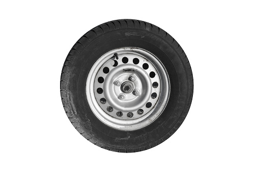 Closeup photo of trailer wheel isolated on white background