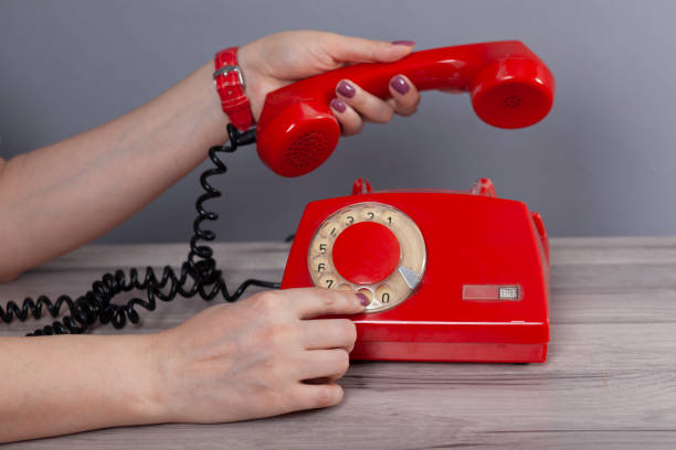 istock woman hand vintage phone 1214756477
