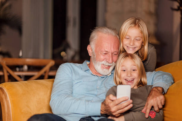 istock Grandfather with his granddaughters 1214758061