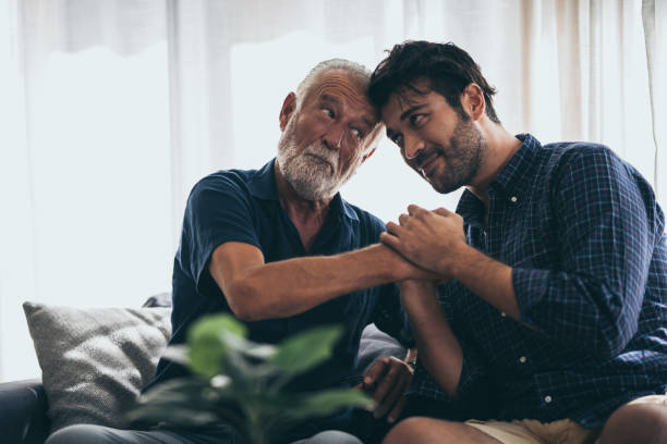 istock Hipster son with his senior father at home. 1214758495