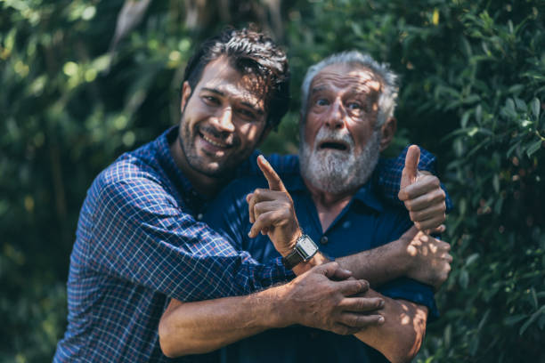 istock Hipster son with his senior father at home. 1214758616