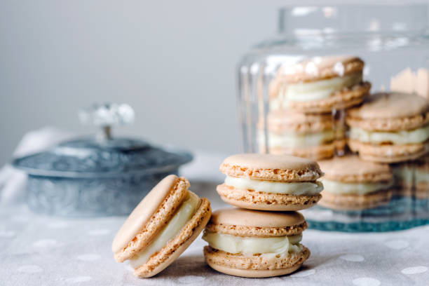 istock Homemade macarons pastries with custard on the table 1214759226