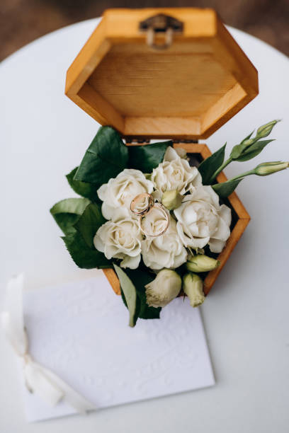 istock gold wedding rings with a wedding decor 1214759413