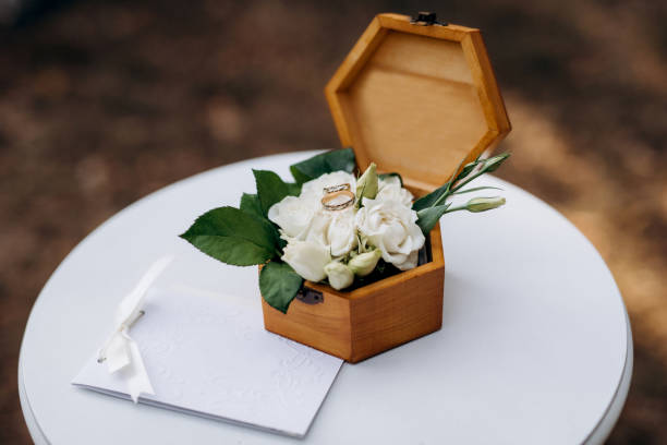istock gold wedding rings with a wedding decor 1214759503