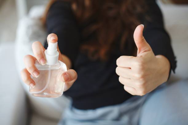 istock Hand holding disinfectant spray, hand gesture „good“ 1214759865