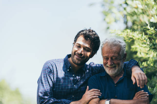 The happy father and son greeting outdoor stock photo