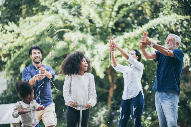 istock Multi-generation family having fun together outdoors 1214761113