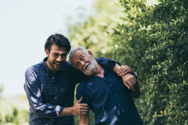 istock Hipster son with his senior father at home. 1214761116