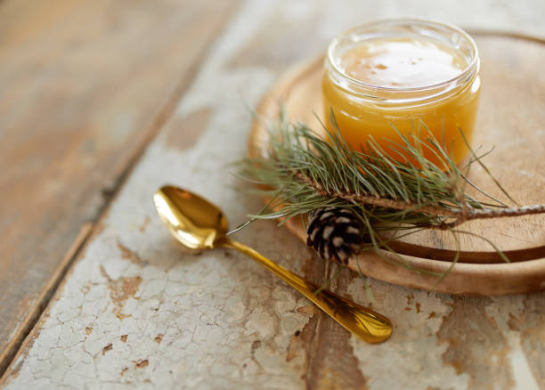 istock Honey jar on vintage wooden table. Top side view with copy space. Selective focus 1214762632