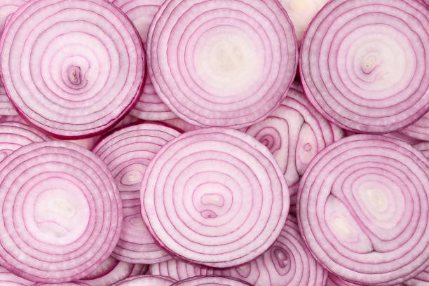 istock Onion slices as a background. Top view. 1214762711