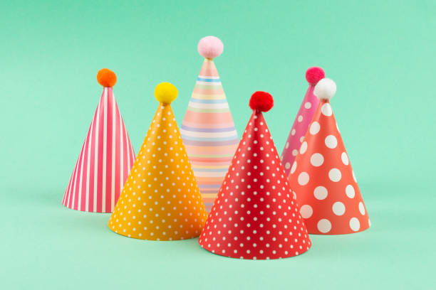 istock Colorful birthday caps on mint background. 1214762830