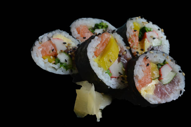 istock tradicional shushi with salmon, mango and kani in a black background 1214763153