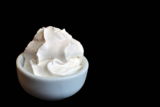 Chantilly cream ingredient isolated in a black backgroun