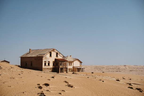 wideangle view of desert ghost town of Kolmanskop Luderitz in Namibia wideangle view of desert ghost town of Kolmanskop Luderitz in Namibia Africa kolmanskop namibia stock pictures, royalty-free photos & images