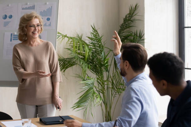 istock Businesswoman interact with active employee at briefing 1214766097
