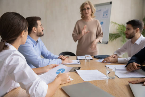istock Concentrated businesspeople brainstorm discuss ideas at meeting 1214766111