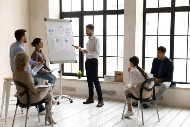 istock Male team leader present project at office briefing 1214766147