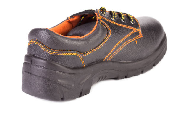 istock Black man's boot with orange inset. 1214766278