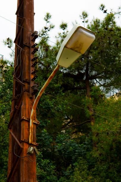 istock Rusty electricity pylon and street light 1214767649