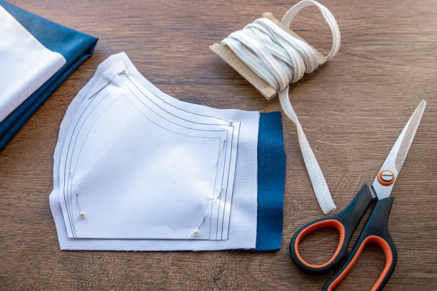 istock Sewing protective face masks at home during a covid-19 pandemic 1214768747