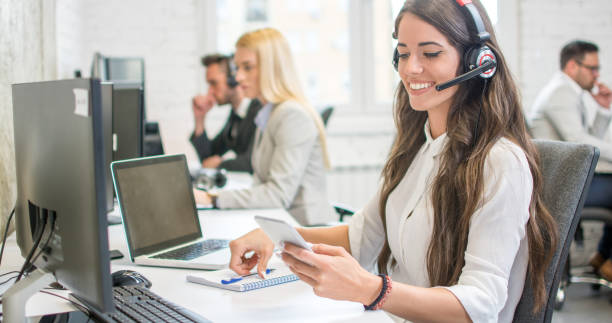 istock Beautiful young businesswoman checking her phone while working in office 1214768763