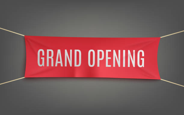 Realistic red grand opening banner hanging on a grey wall Realistic red grand opening banner hanging on a grey wall - opening ceremony decoration element or business launch announcement sign, vector illustration. opening stock illustrations