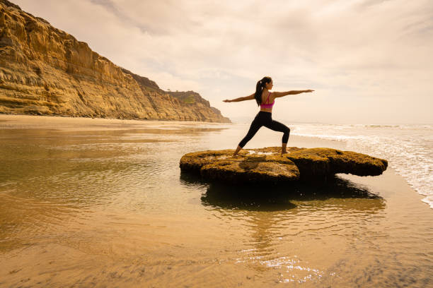 Women Doing Yoga Torrey Pines Women Doing Yoga Torrey Pines Beach and Bluffs torrey pines state reserve stock pictures, royalty-free photos & images