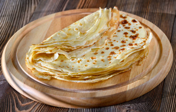 istock Crepes on wooden board 1214773512