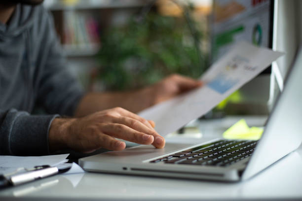 istock Businessman using laptop computer in the homeoffice 1214774620