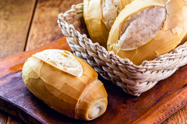 istock several traditional breads from brazil, on a rustic wooden background in a straw basket. National day of Brazilian French bread. 1214776215